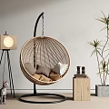 Indoor Wicker Hanging Chair With Round Design Cat Floor Lamp Potted Plant And Wooden Box