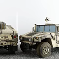Two Military Humvees with Antennas and Roof Equipment on Gravel Ground