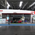 YAMAHA Exhibition Booth Featuring Red and White Design Large Display Screens and Counters