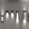 Modern Wall Sconces With Various Designs And Metal Finishes Displayed On Gray Wall
