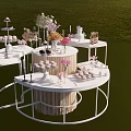 Outdoor Dessert Shop Display With White Tables Sweet Treats And Flower Bouquets