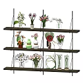 Various Flowers In Decorative Vases Arranged On Multi Tiered Shelf 3d model