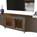 Elegant Wooden TV Stand with Glass Doors Golden Handles Blue Vase and Books
