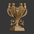 Golden Metallic Trophy Shaped Home Decor Ornament With Spherical Top And Square Base