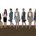 Group of professional women standing and sitting against white wall on wooden floor
