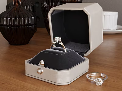 Elegant Diamond Ring Inside Open Jewelry Box With Pearl Detail And Small Ring On Wooden Table 3d model