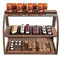 Delicious Assorted Desserts in Glass Display Case with Cakes Macarons Pastries and Packaged Treats