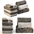 Soft Gray Towels Stacked and Rolled in Various Styles for Bathroom Decor