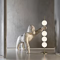 Marble Gorilla Sculpture With Gold Lamp Stand And White Spheres In Modern Interior