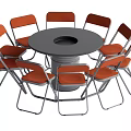 Round Dining Table with Gray Tabletop Central Hole Surrounded by Eight Orange Metal Frame Chairs
