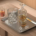 Elegant Crystal Whiskey Decanter And Glass With Ice Cubes On Silver Tray Wooden Tabletop