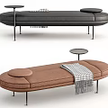 Modern Gray And Brown Ottoman With Round Cushion Plaid Blanket And Metal Legs Design