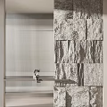 Modern Interior Partition With Stone Wall And Curved Metal Strips Near Sofa And Green Plant