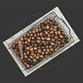 Wire Metal Shopping Basket Filled With Nuts On Marble Countertop With Blue Handle