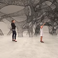 Intricate Wire Mesh Sculpture Installation In Art Exhibition Space With Adult And Child Observing