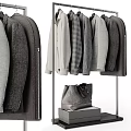 Standing Clothes Rack with Hanging Sweaters Shirts Coats and Leather Bag in Modern Style