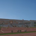 Modern School Building With Playground Track Field Basketball Hoops Red Flag And Trees