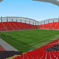 Modern Sports Stadium Featuring Green Football Turf Red Seats And Arch Roof Structure
