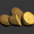 Golden Shiny Potatoes Whole and Sliced on Black Reflective Surface