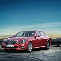 Red Mercedes Benz Sedan Against Urban Night View