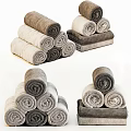 Rolled Towels in Gray and Beige Colors Neatly Stacked into Pyramid Shaped Arrangement