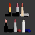 Various Colored Lipsticks With Different Casing Designs Arranged On Shiny Surface