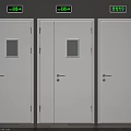 White Safety Exit Doors With Green Direction Signs In Building Corridor