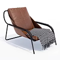 Modern Brown Leather Lounge Chair With Black Metal Frame And Checkered Blanket