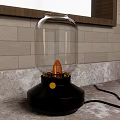 Table Lamp With Glass Shade Black Base Yellow Knob And Orange Bulb On Marble Countertop