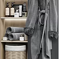 Soft Rolled Towels On Wooden Shelf With Cozy Bathrobe And Bathroom Accessories