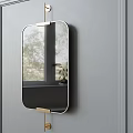 Oval Mirror with Metal Frame Hanging on Gray Wall Reflecting Window View And Indoor Plant