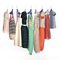 Colorful Children's Clothes Hanging With Striped Star Polka Dot And Floral Designs