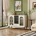 White Tea Cabinet With Glass Doors And Decorative Items On Top With Green Wall Background