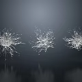 Three Dynamic Water Fountains With Splashing Water And Dark Background Reflections