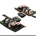 Fresh Sushi Rolls Served on Black Plates with Soy Sauce and Chopsticks Garnish
