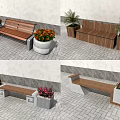 Public Bench With Wooden Seat And Concrete Base Near Colorful Flower Pots On Paved Ground