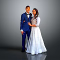 Couple In Formal Blue Suit And White Gown Pose Together