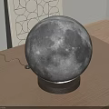 Realistic Moon Lamp With Wooden Base On Table And Geometric Wall Art
