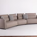 Light Brown Sectional Three Seater Sofa Featuring Plaid Pillows And White Wall Floor 3d model
