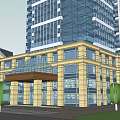 Modern Hotel Building with Glass Facade and Yellow Exterior Featuring Entrance Canopy and Surrounding Trees