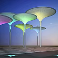 Colorful Umbrella Shaped Outdoor Structures With Supporting Pillars And Blue Sky
