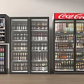 Beverage Refrigerators And Freezers Stocked With Various Drinks Including Coca-Cola Products