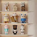 Decorative Figurine Set Featuring Various Cute Animal Character Designs Different Colors On White Shelves