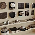 Modern Kitchen Appliances With Various Cooktops Pots Pans And Shelf