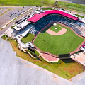 Aerial View Of Modern Baseball Stadium With Red Roof Stands And Green Playing Field