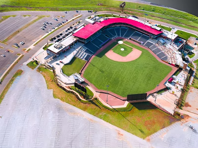 Aerial View Of Modern Baseball Stadium With Red Roof Stands And Green Playing Field 3d model