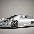 Silver Sports Car With Streamlined Body Sleek Front Headlights And Black Alloy Wheels