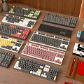 Colorful Computer Keyboards in Various Styles Display on Wooden Desk with Accessories