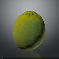 Fresh Green Lemon With Textured Surface And Yellow Hues On Dark Background