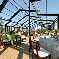 Glass Canopy Event Space With Wooden Floors And Natural Tree Backgrounds